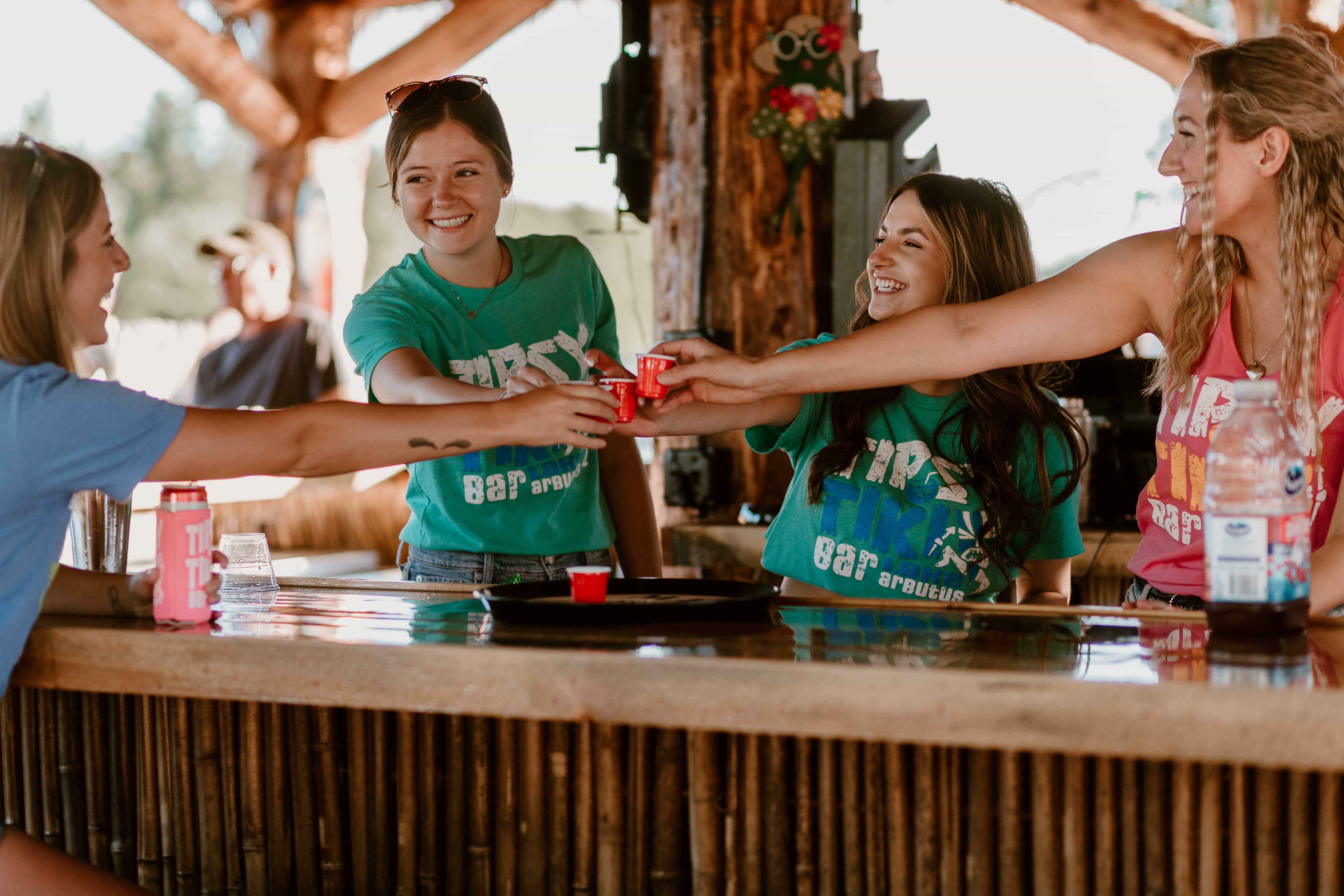 Customers cheering with shots